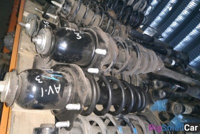 Стойка амортизатора задняя Тойота авенсис